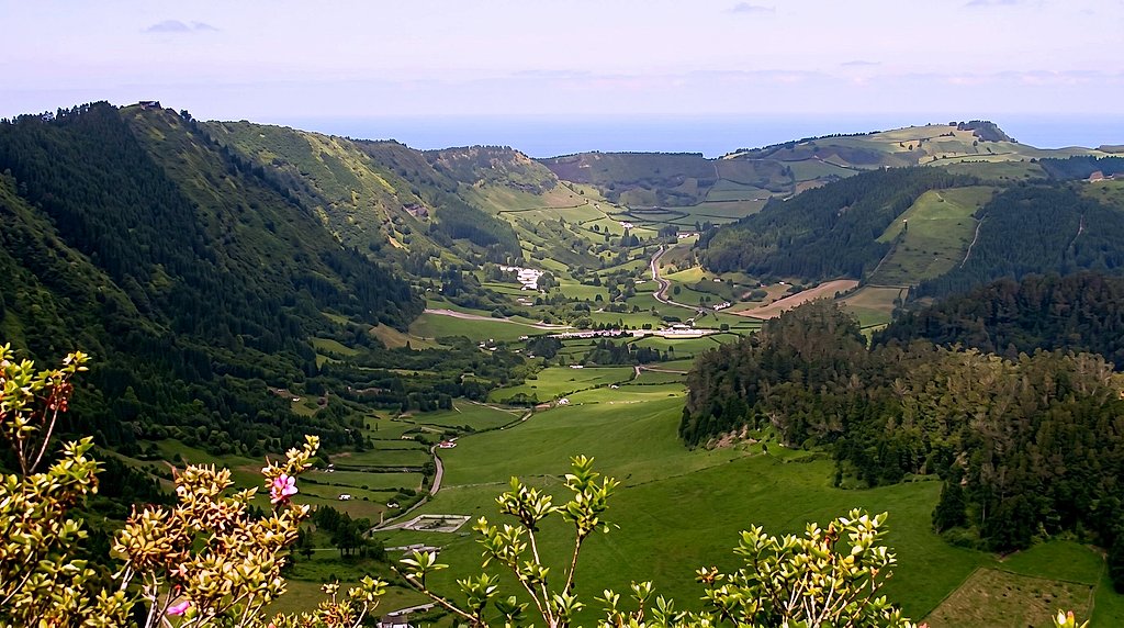 Panoramic view down the crater valley toward farmland, forest and the Atlantic coastline